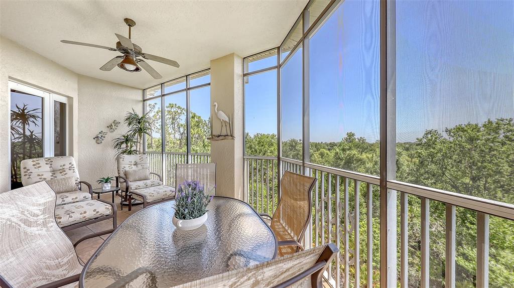 6465 Water Crest Way, Unit 404 Lakewood Ranch, FL 34202 - Photo 12 of 62 a view of a livingroom with furniture and window