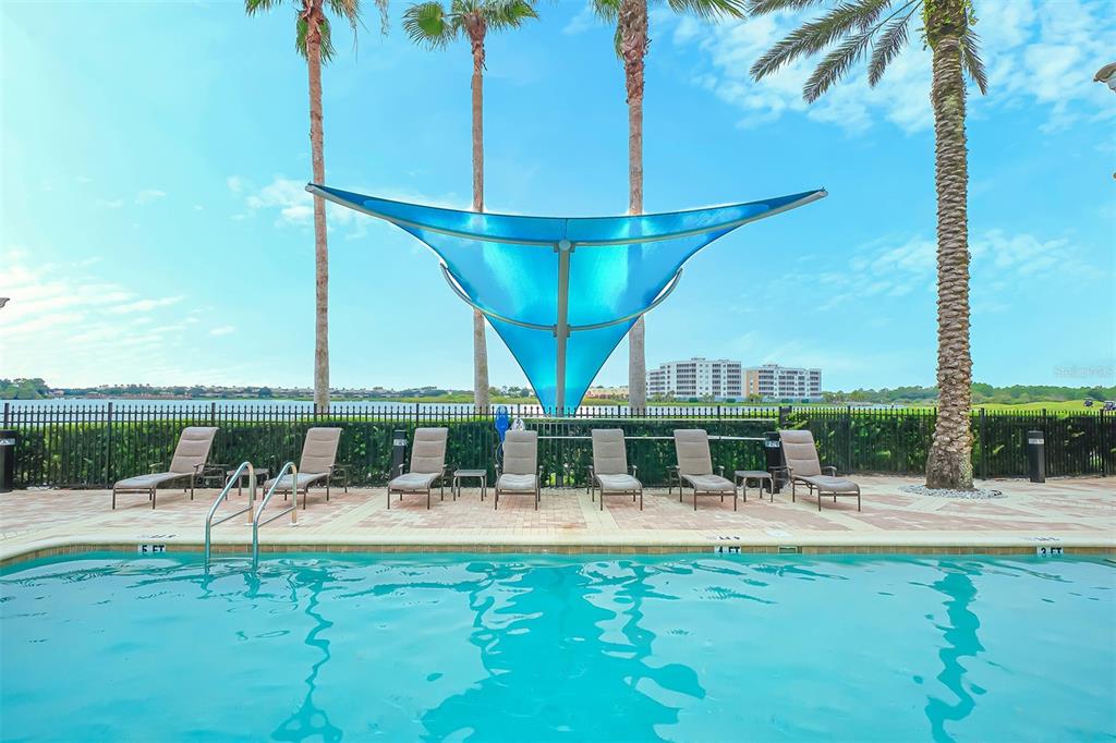 6465 Water Crest Way, Unit 404 Lakewood Ranch, FL 34202 - Photo 51 of 62 a view of swimming pool with seating area and furniture