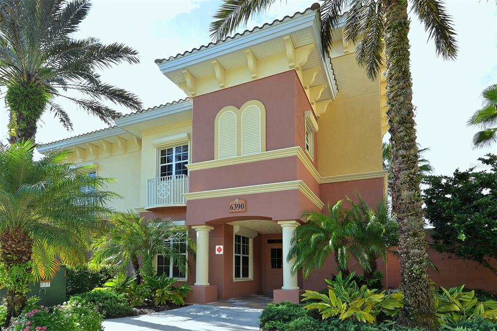 6465 Water Crest Way, Unit 404 Lakewood Ranch, FL 34202 - Photo 62 of 62 a front view of a house with a yard