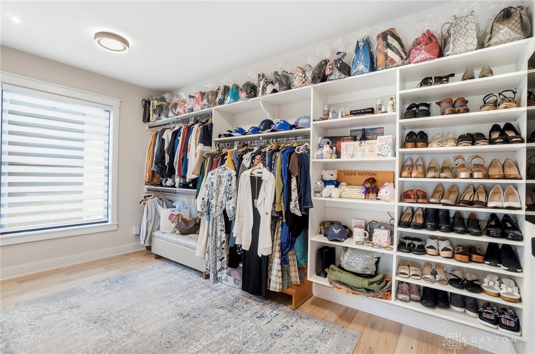 1247 Normandy Rue Dayton, OH 45458 - Photo 28 of 76 This spacious closet offers custom built-in shelving, hardwood flooring, and ample natural light.