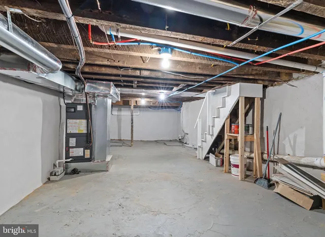 a view of an empty room with wooden roof