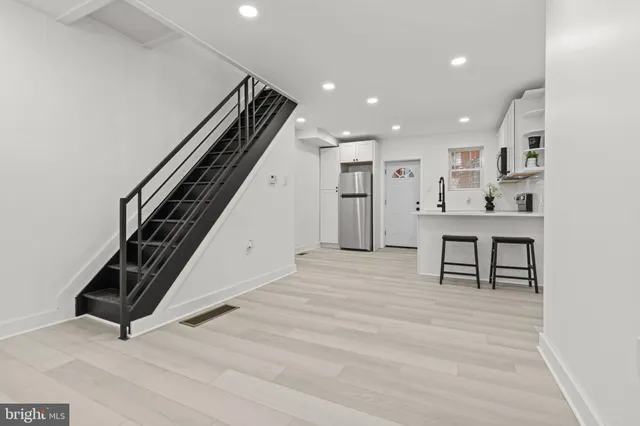 a view of a hallway with seating area