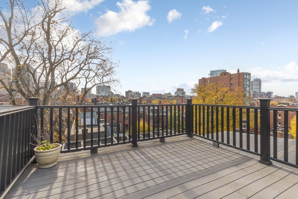 14 Chestnut Street, Unit 4 Boston, MA 02108 - Photo 2 of 12 a view of a roof with wooden floor and fence