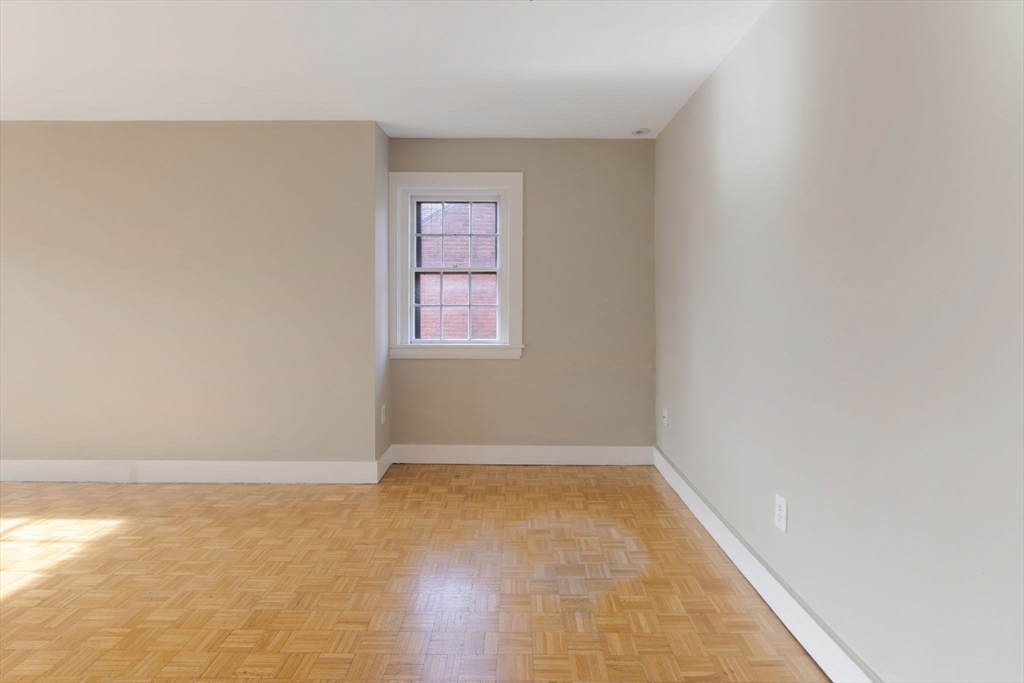 14 Chestnut Street, Unit 4 Boston, MA 02108 - Photo 9 of 12 an empty room with windows