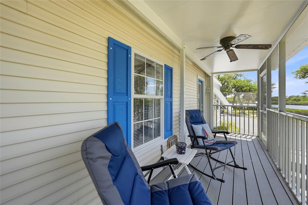10303 Burnt Store Road, Unit 143 Punta Gorda, FL 33950 - Photo 25 of 42 a view of a balcony with furniture and wooden floor