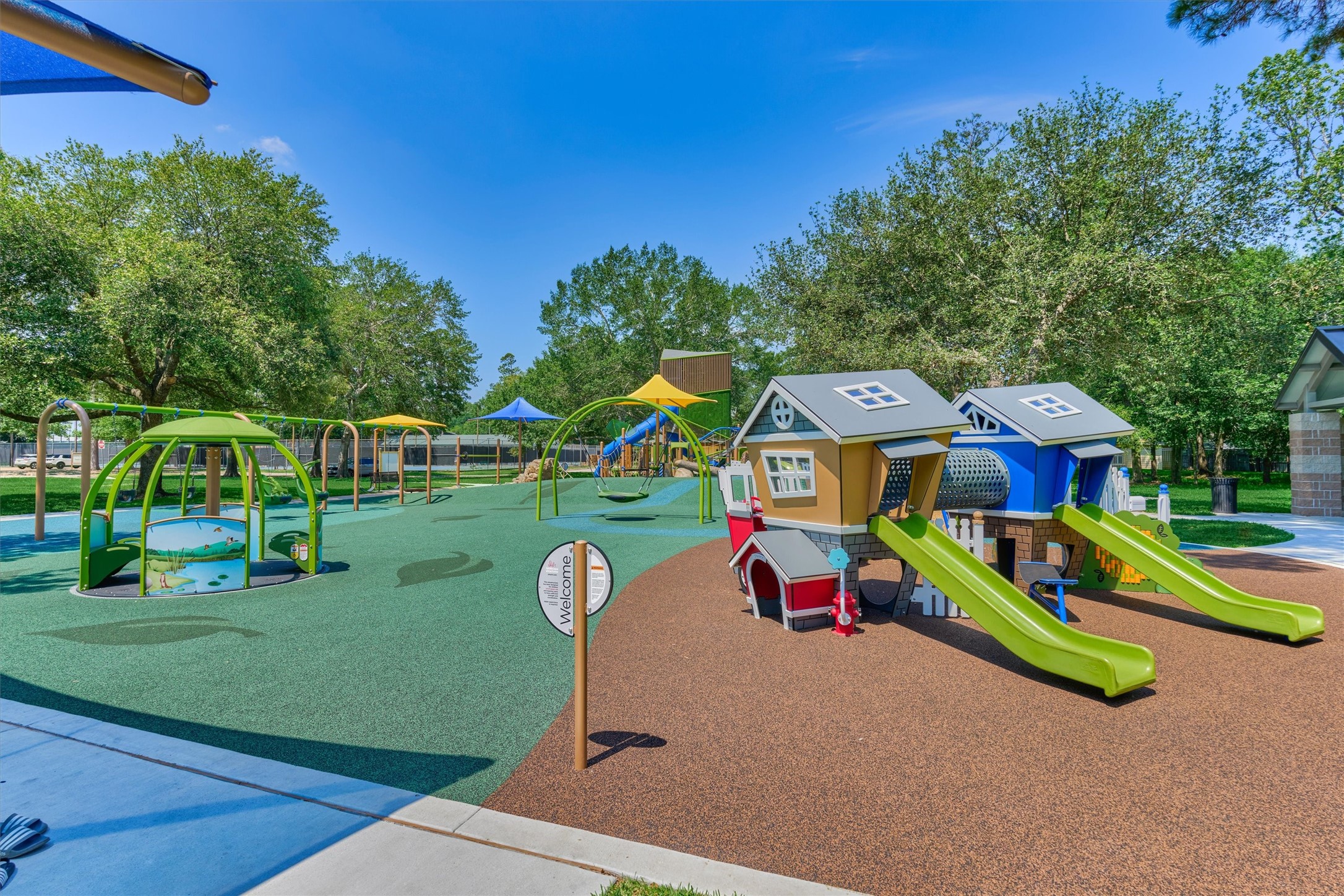 6515 Glenhill Drive Spring, TX 77389 - Photo 36 of 39 a childrens park with lots of swings and slides