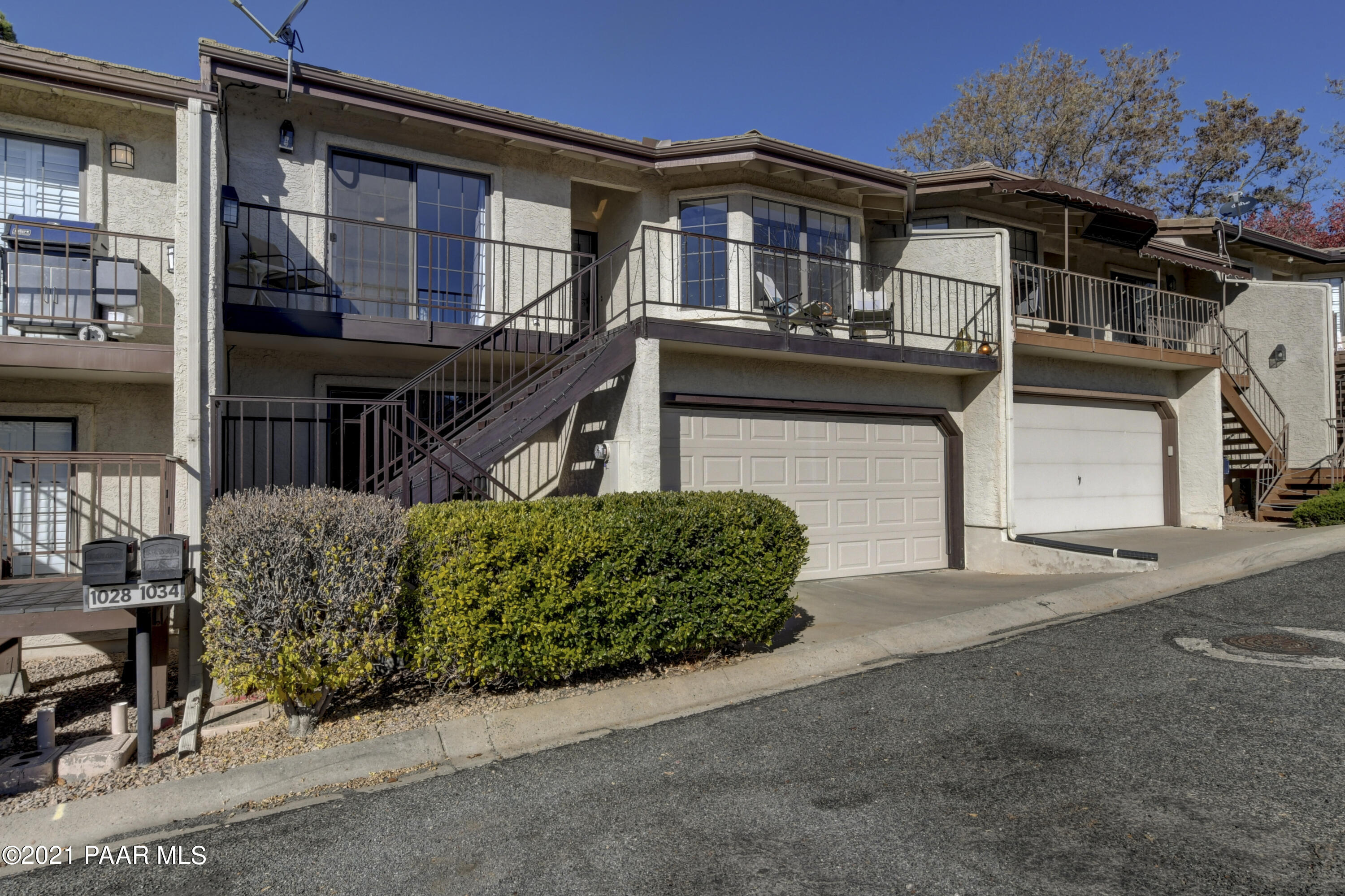 a front view of a house with a garage