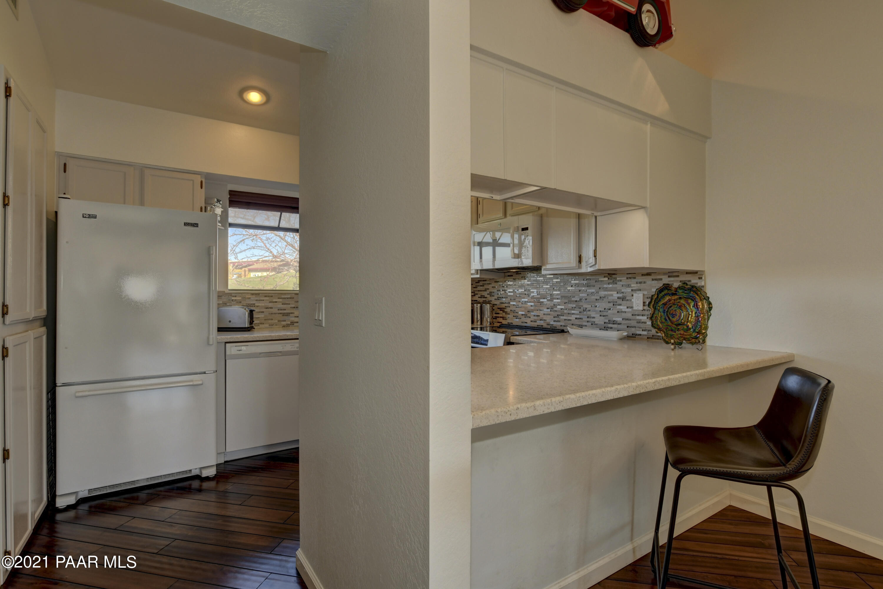 1034 Bunker Place Dewey, AZ 86327 - Photo 11 of 40 a kitchen with a refrigerator and a stove top oven