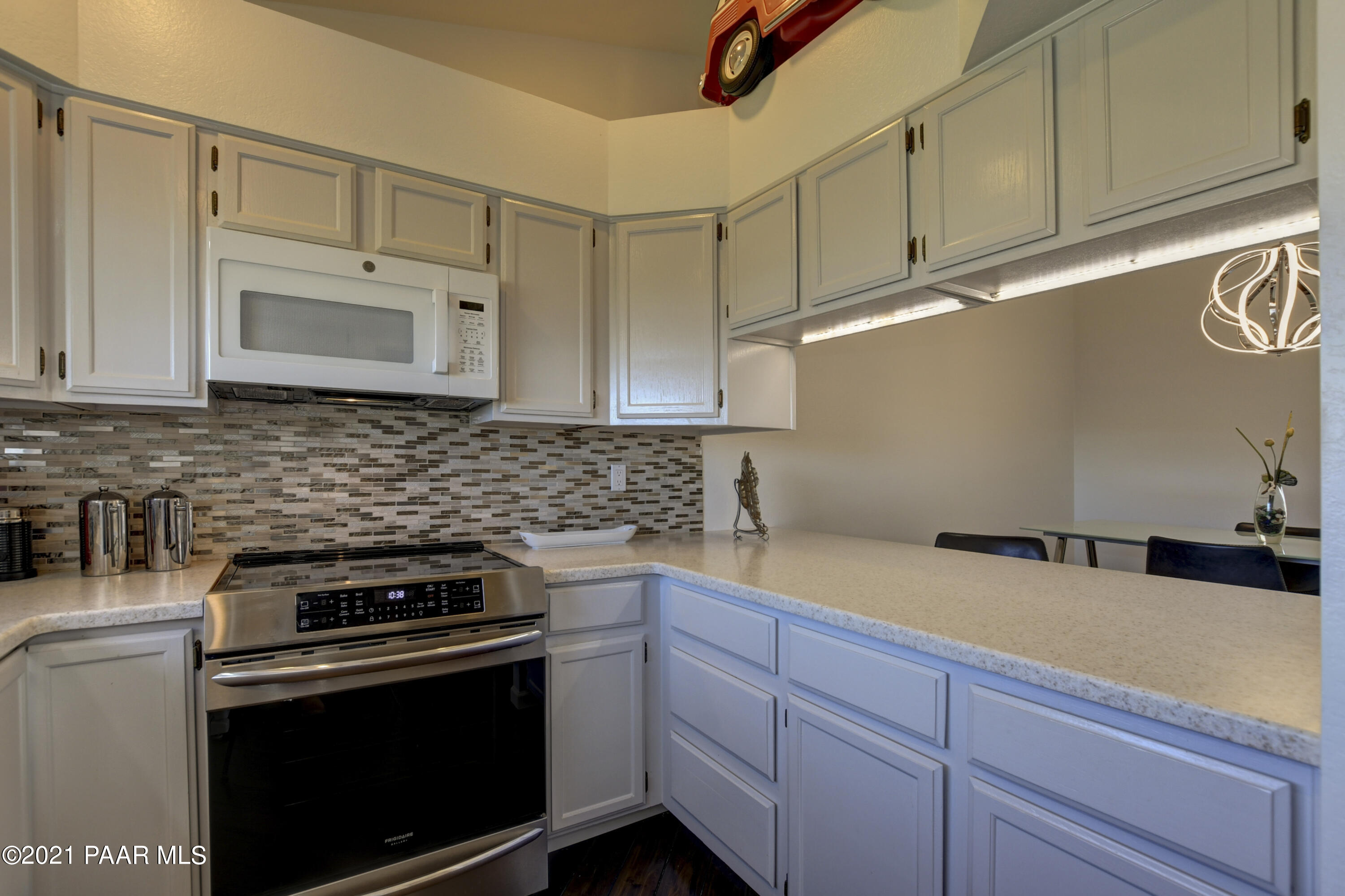 1034 Bunker Place Dewey, AZ 86327 - Photo 14 of 40 a kitchen with stainless steel appliances granite countertop a sink a stove and cabinets