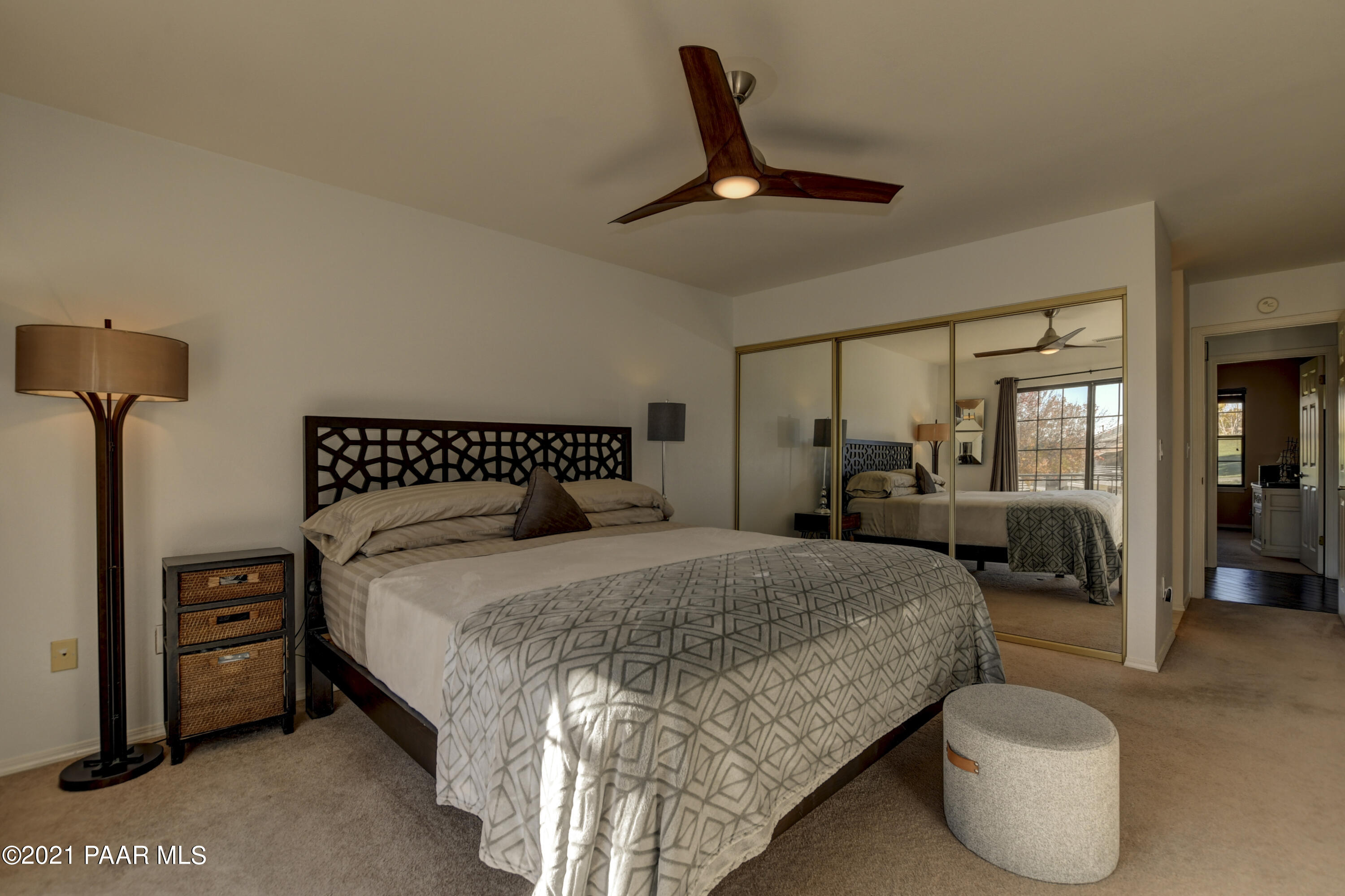 1034 Bunker Place Dewey, AZ 86327 - Photo 16 of 40 a bedroom with a bed and ceiling fan