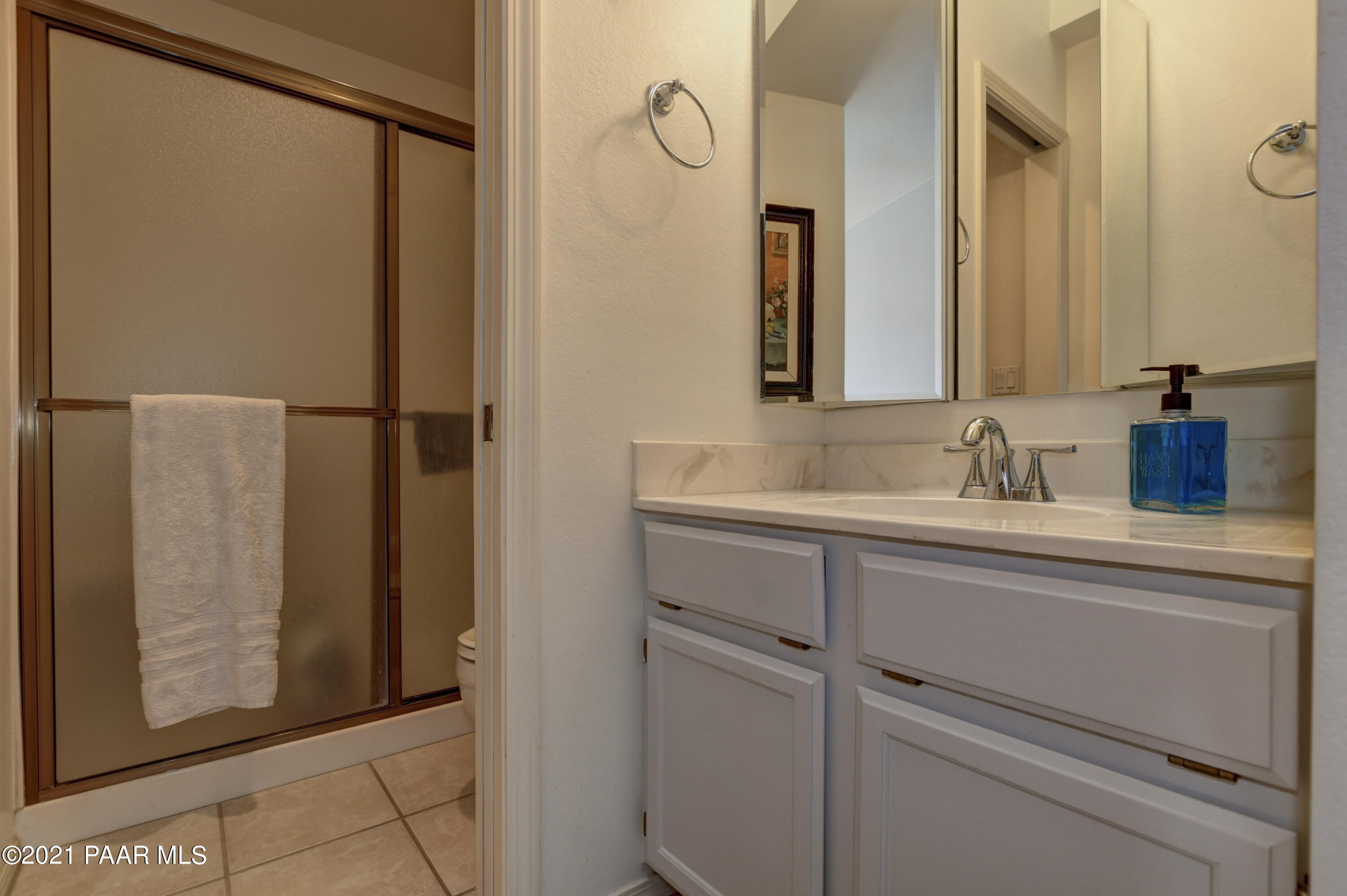 1034 Bunker Place Dewey, AZ 86327 - Photo 17 of 40 a bathroom with a shower sink and mirror