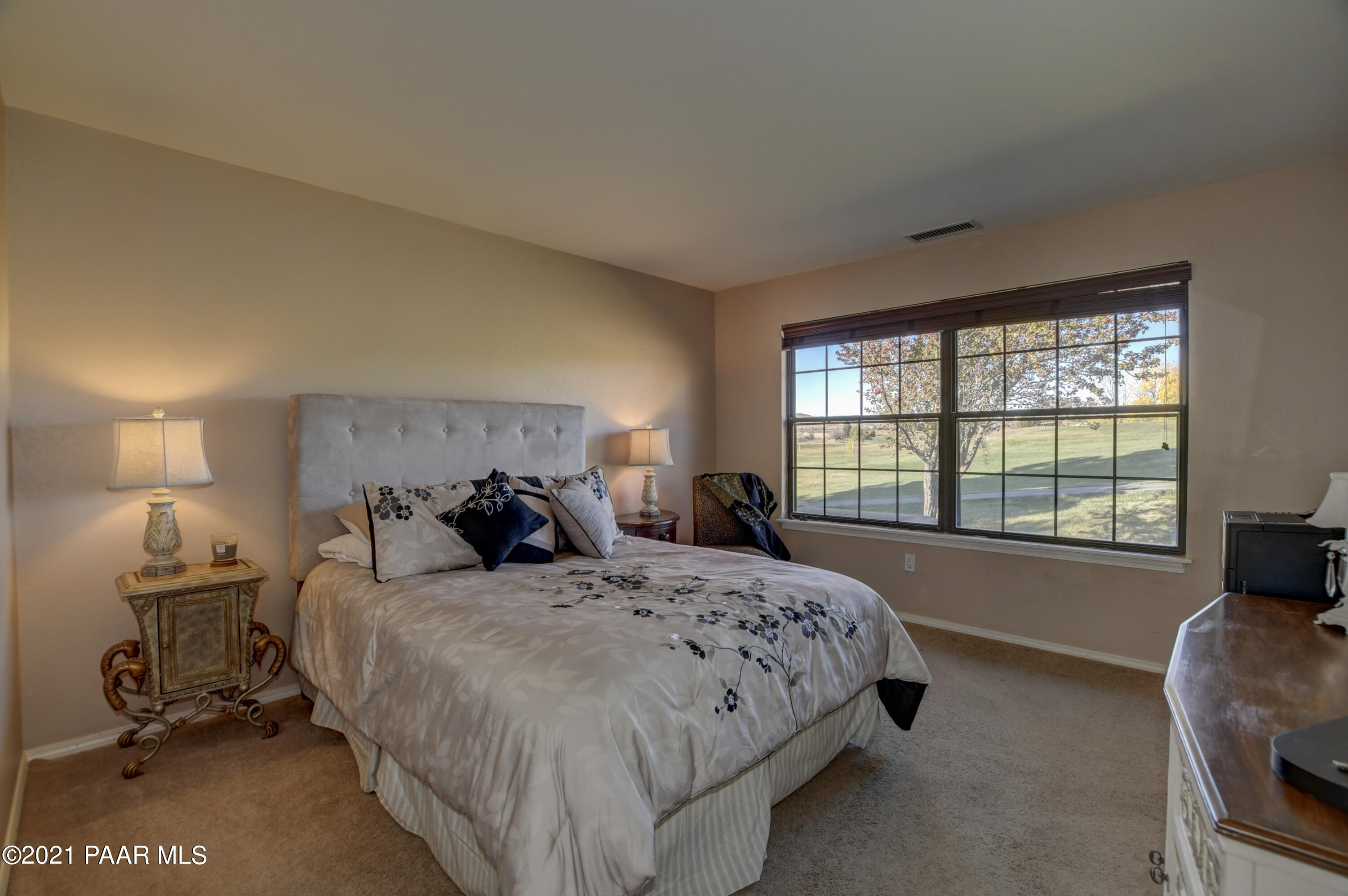 1034 Bunker Place Dewey, AZ 86327 - Photo 18 of 40 a bedroom with a bed and a couch