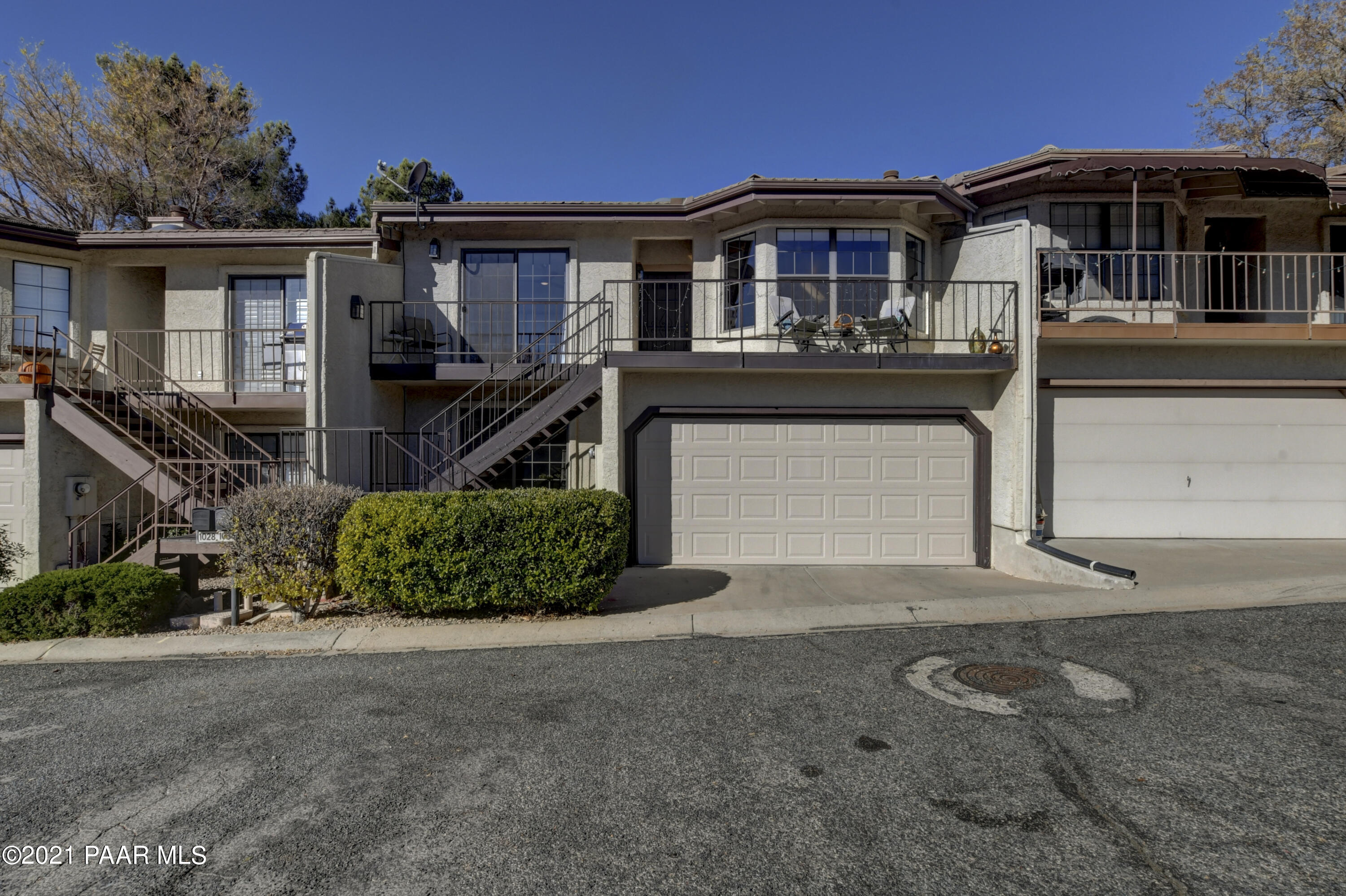 1034 Bunker Place Dewey, AZ 86327 - Photo 2 of 40 a front view of a house with a yard and garage