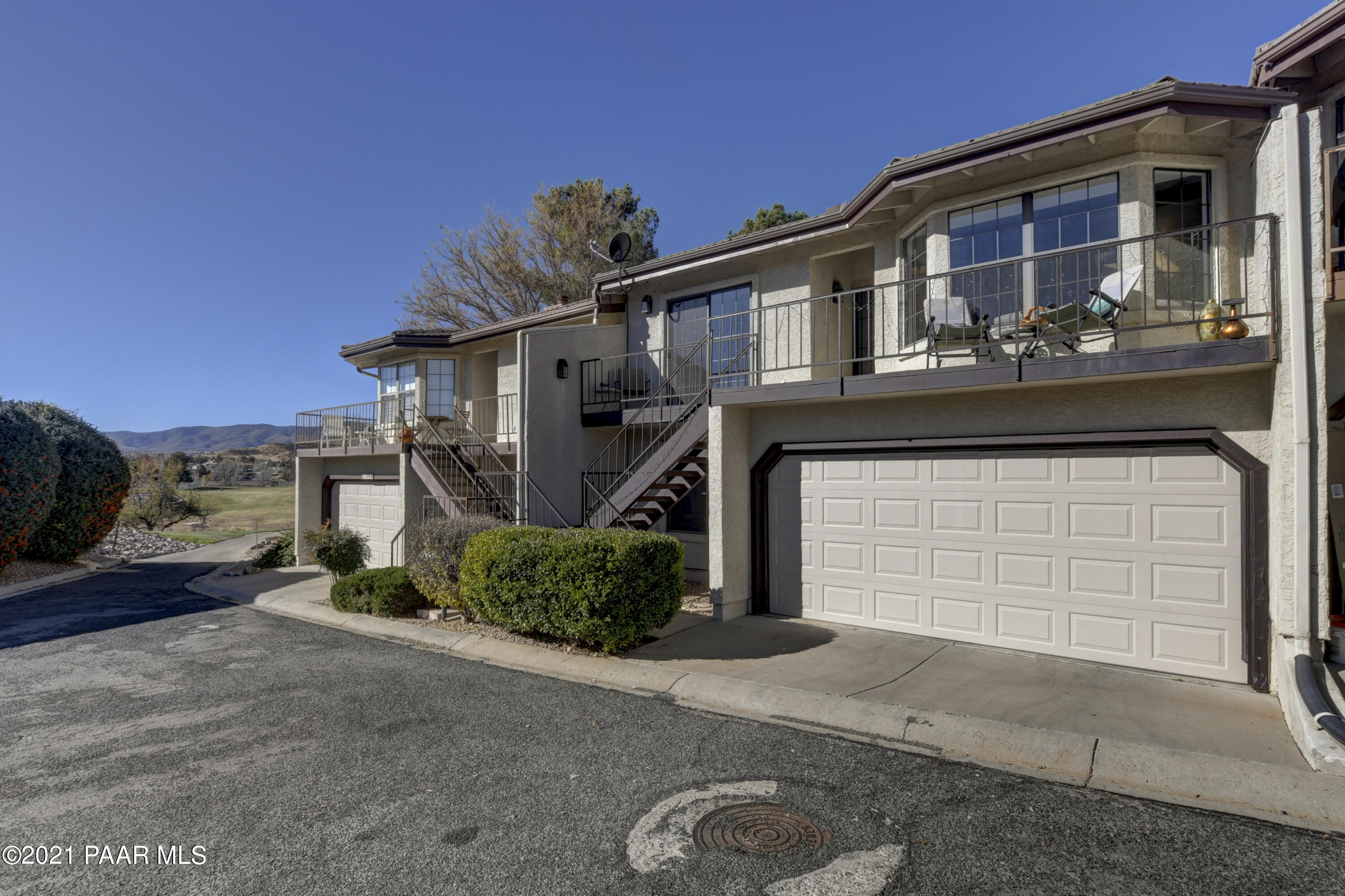 1034 Bunker Place Dewey, AZ 86327 - Photo 4 of 40 a front view of a house with a yard and garage