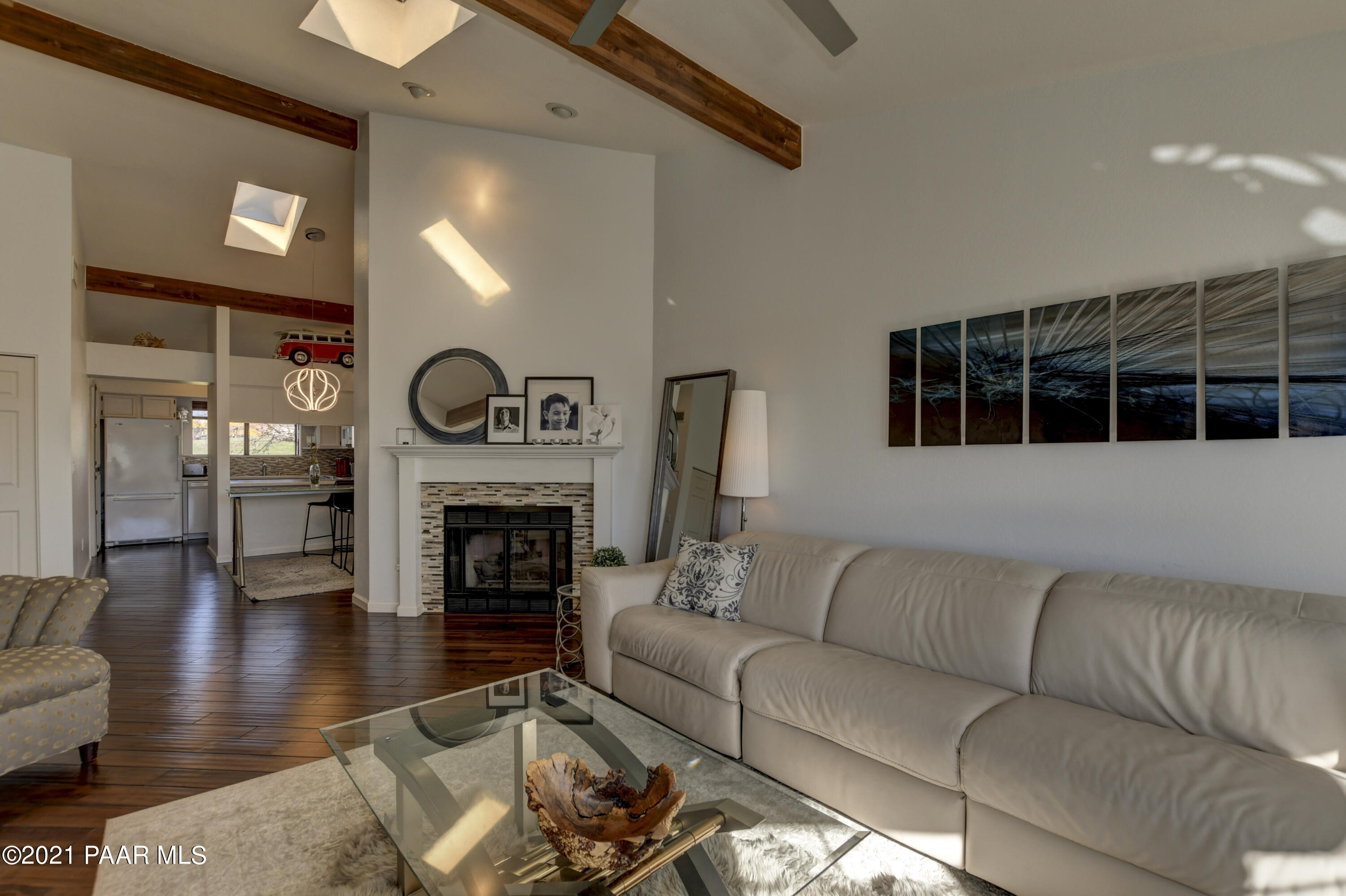 1034 Bunker Place Dewey, AZ 86327 - Photo 7 of 40 a living room with furniture a fireplace and a flat screen tv