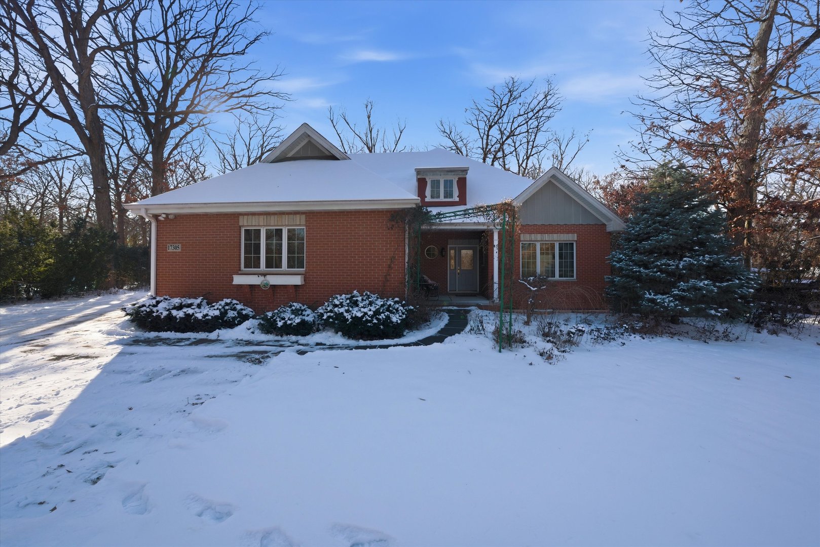 17305 West 145th Street Lockport, IL 60441 - Photo 1 of 29 a view of a house with a yard covered with snow in front of it