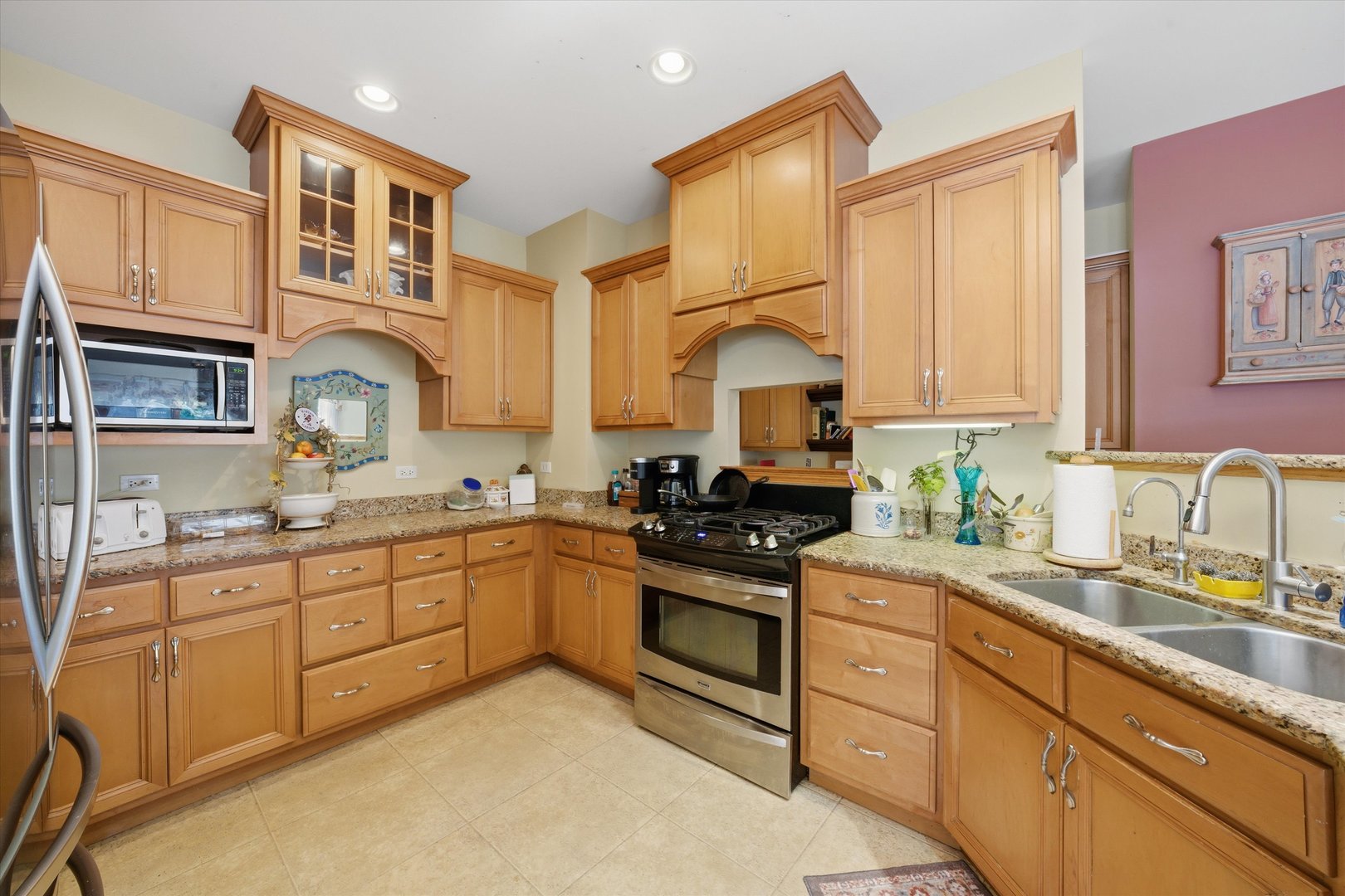 17305 West 145th Street Lockport, IL 60441 - Photo 12 of 29 a kitchen with stainless steel appliances granite countertop a sink and cabinets