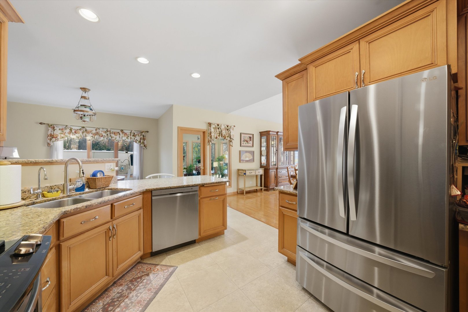 17305 West 145th Street Lockport, IL 60441 - Photo 13 of 29 a kitchen with stainless steel appliances a refrigerator and a sink