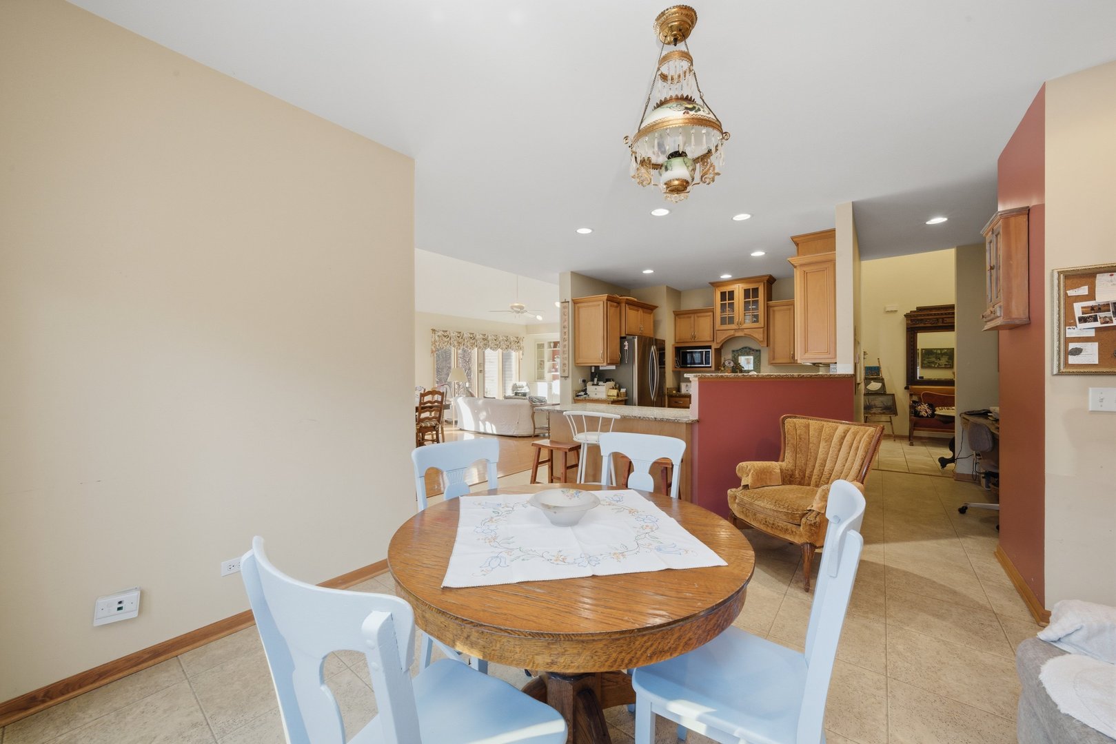 17305 West 145th Street Lockport, IL 60441 - Photo 15 of 29 a dining room with furniture and a chandelier