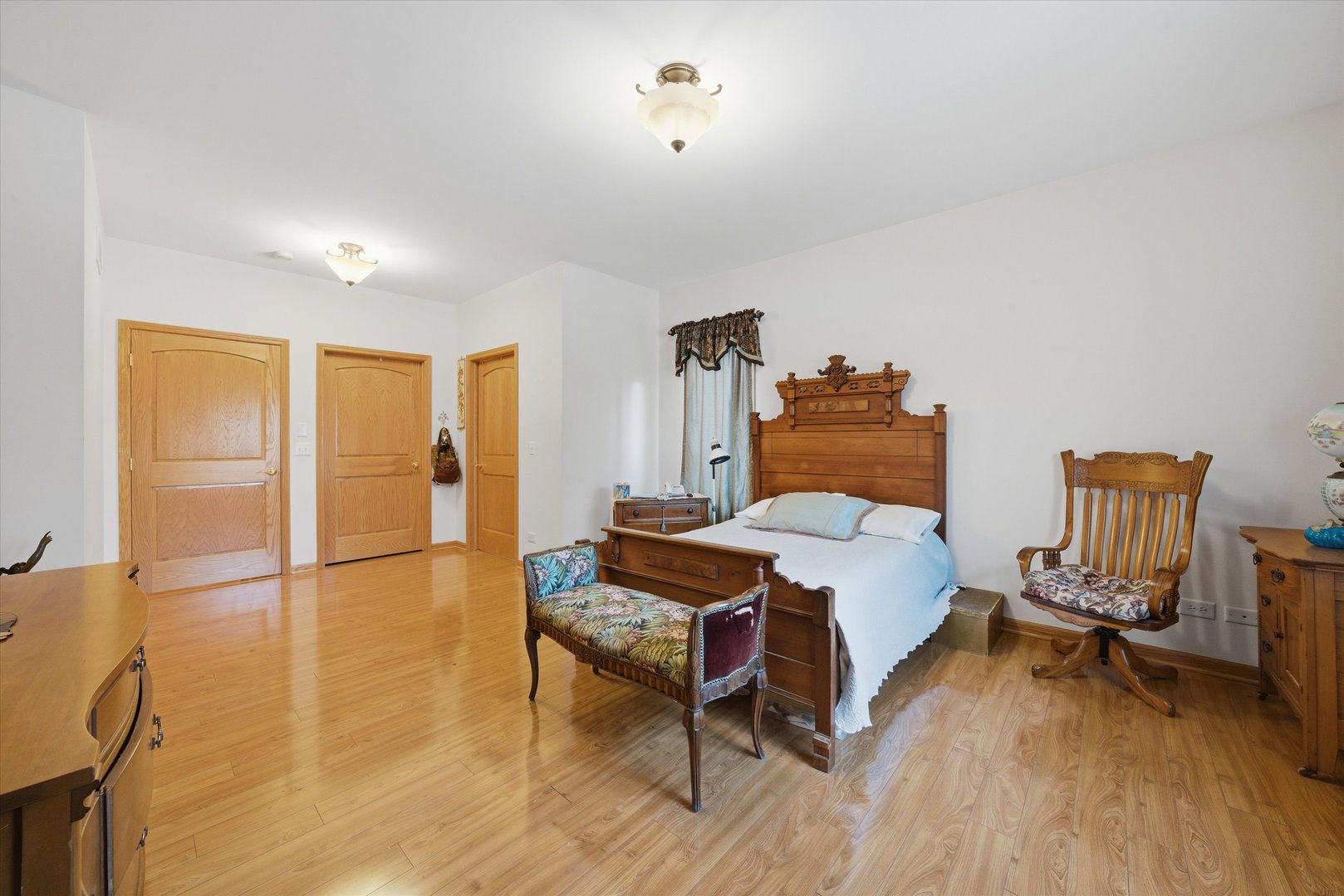 17305 West 145th Street Lockport, IL 60441 - Photo 17 of 29 a bedroom with a bed and wooden floor