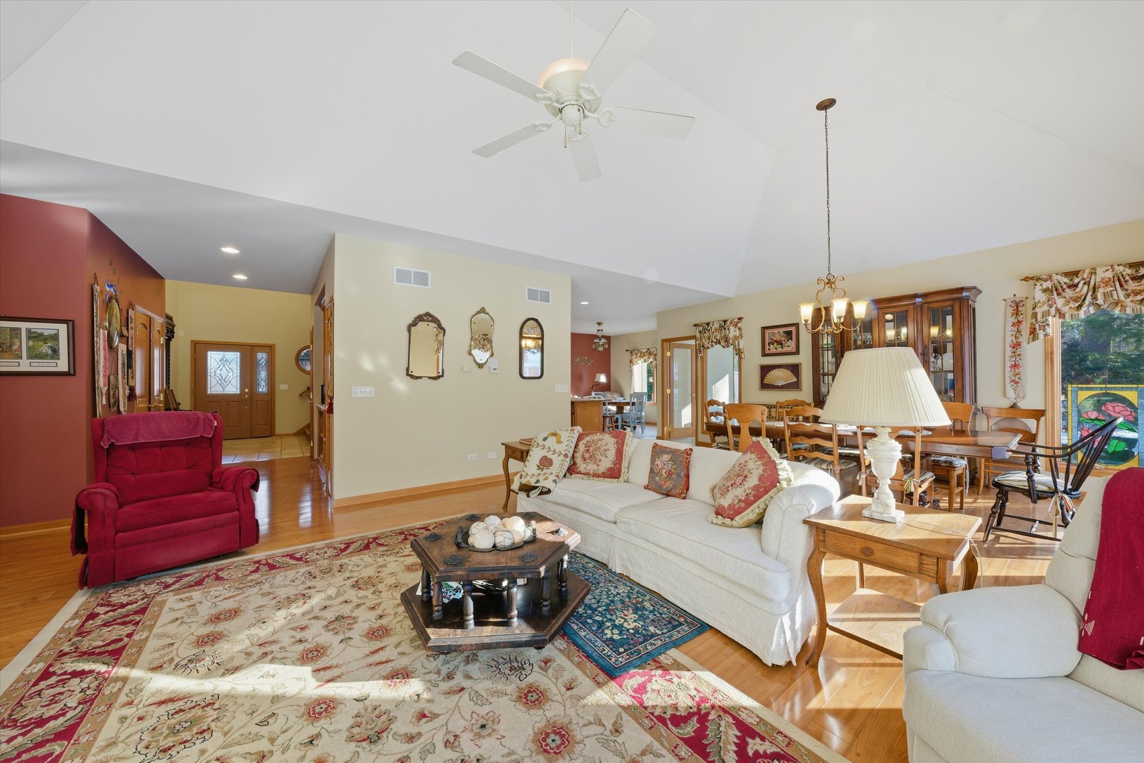 17305 West 145th Street Lockport, IL 60441 - Photo 8 of 29 a living room with furniture a rug and a chandelier