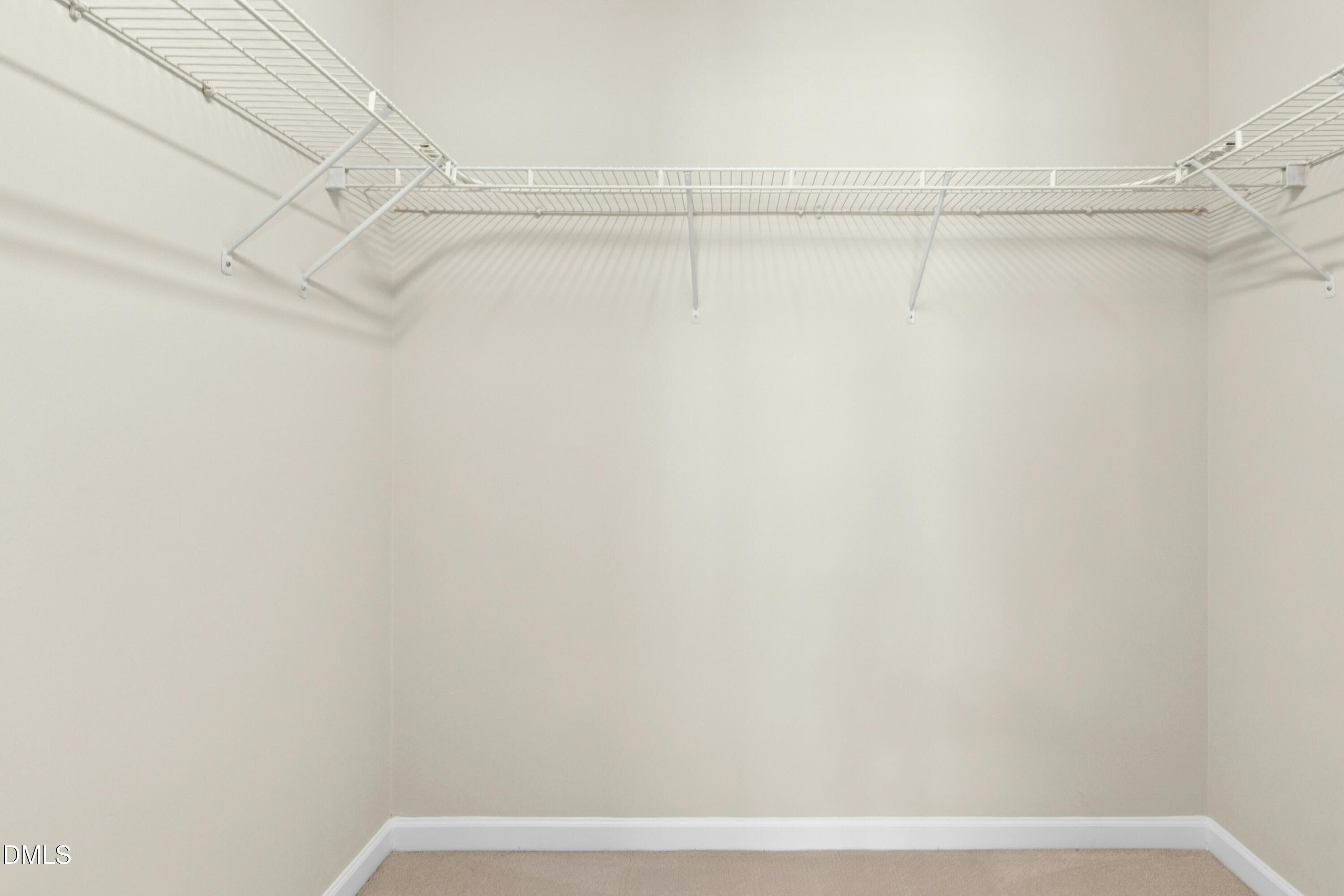 5541 Nur Lane Raleigh, NC 27606 - Photo 22 of 33 a view of a room with racks on the wall