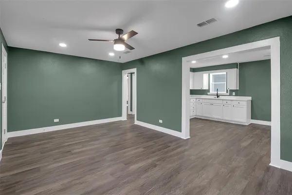 a view of a livingroom with a kitchen