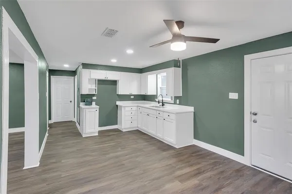 a view of kitchen with wooden floor