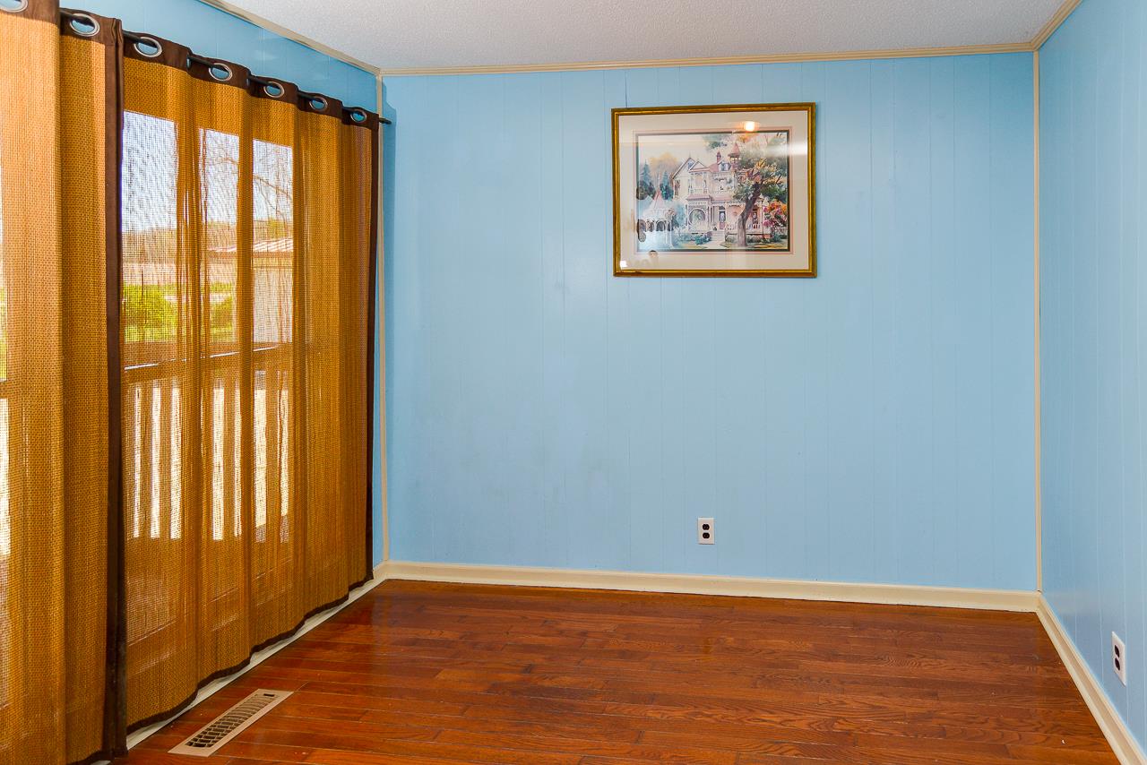 469 Limestone Road Elora, TN 37328 - Photo 13 of 30 a view of an empty room with wooden floor and a window
