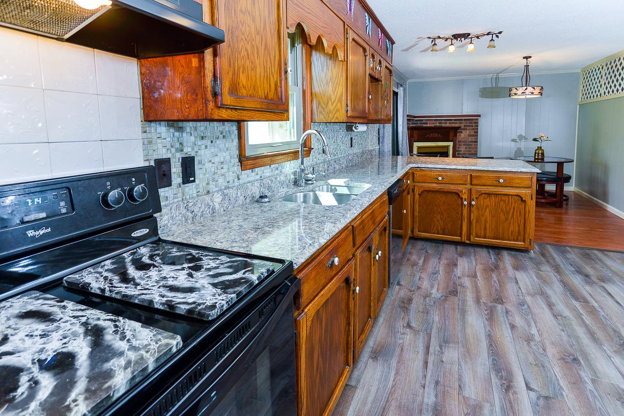 469 Limestone Road Elora, TN 37328 - Photo 15 of 30 a kitchen with stove and wooden floor