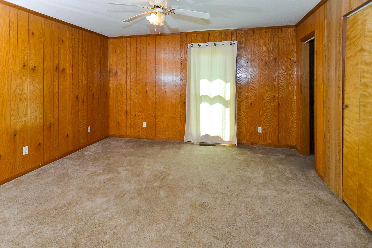469 Limestone Road Elora, TN 37328 - Photo 26 of 30 an empty room with chandelier fan