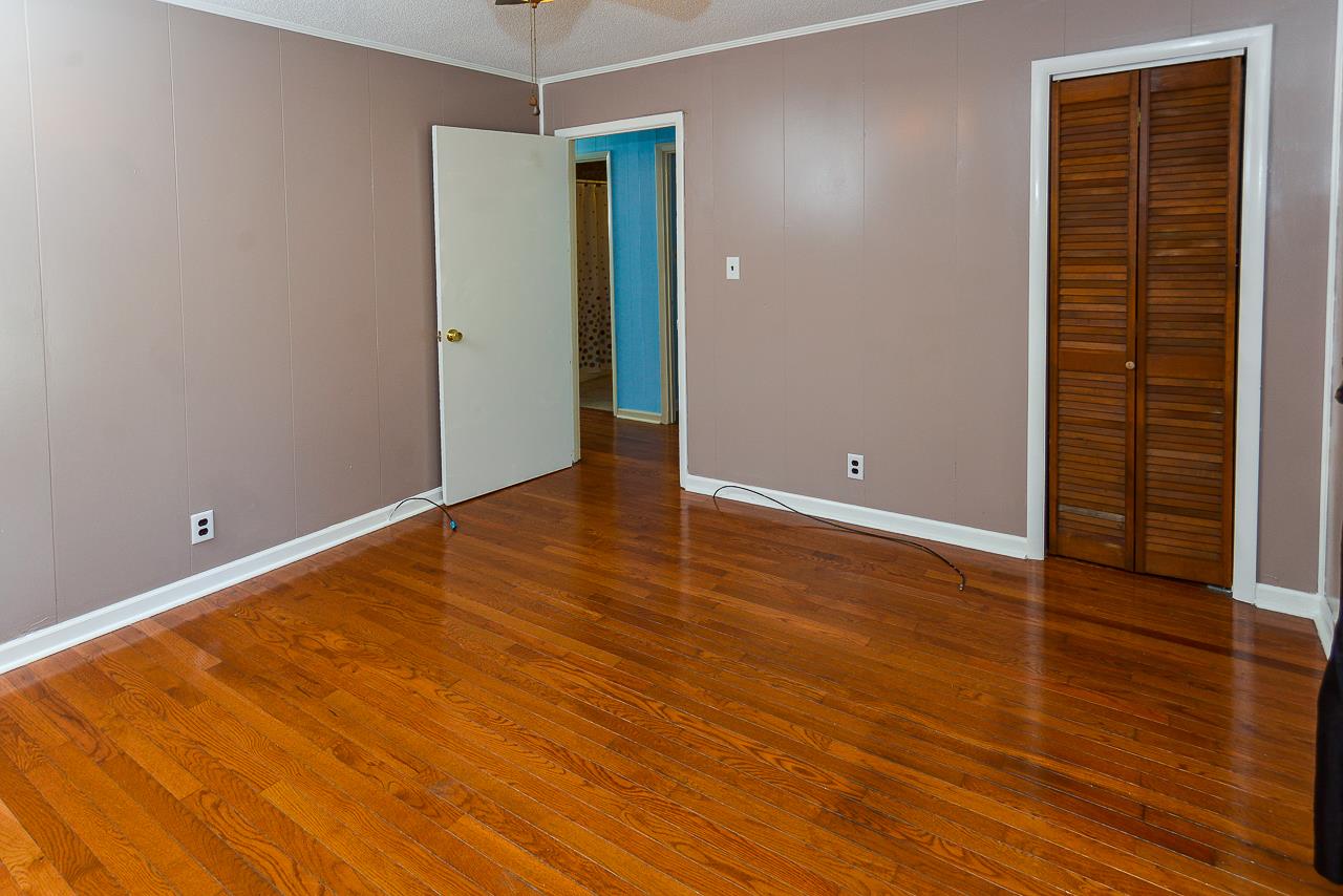 469 Limestone Road Elora, TN 37328 - Photo 27 of 30 an empty room with wooden floor and windows