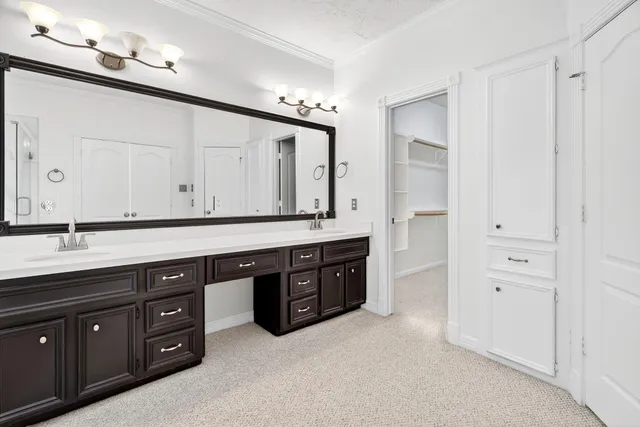 a spacious bathroom with a double vanity sink double and a mirror