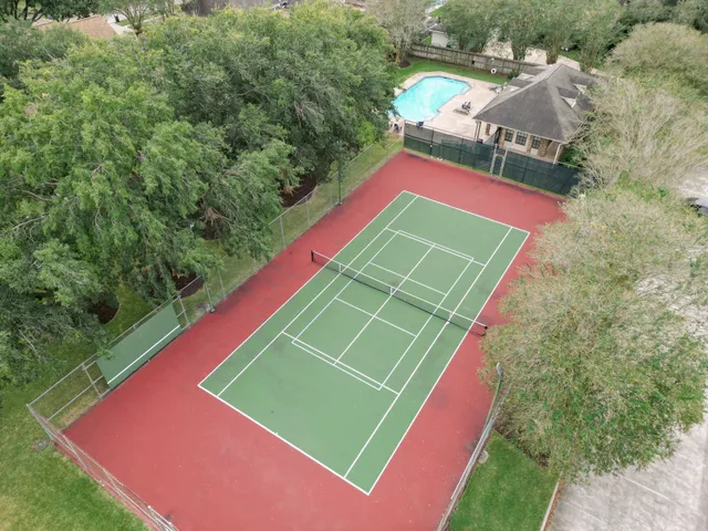 a view of a tennis ground with a tennis court