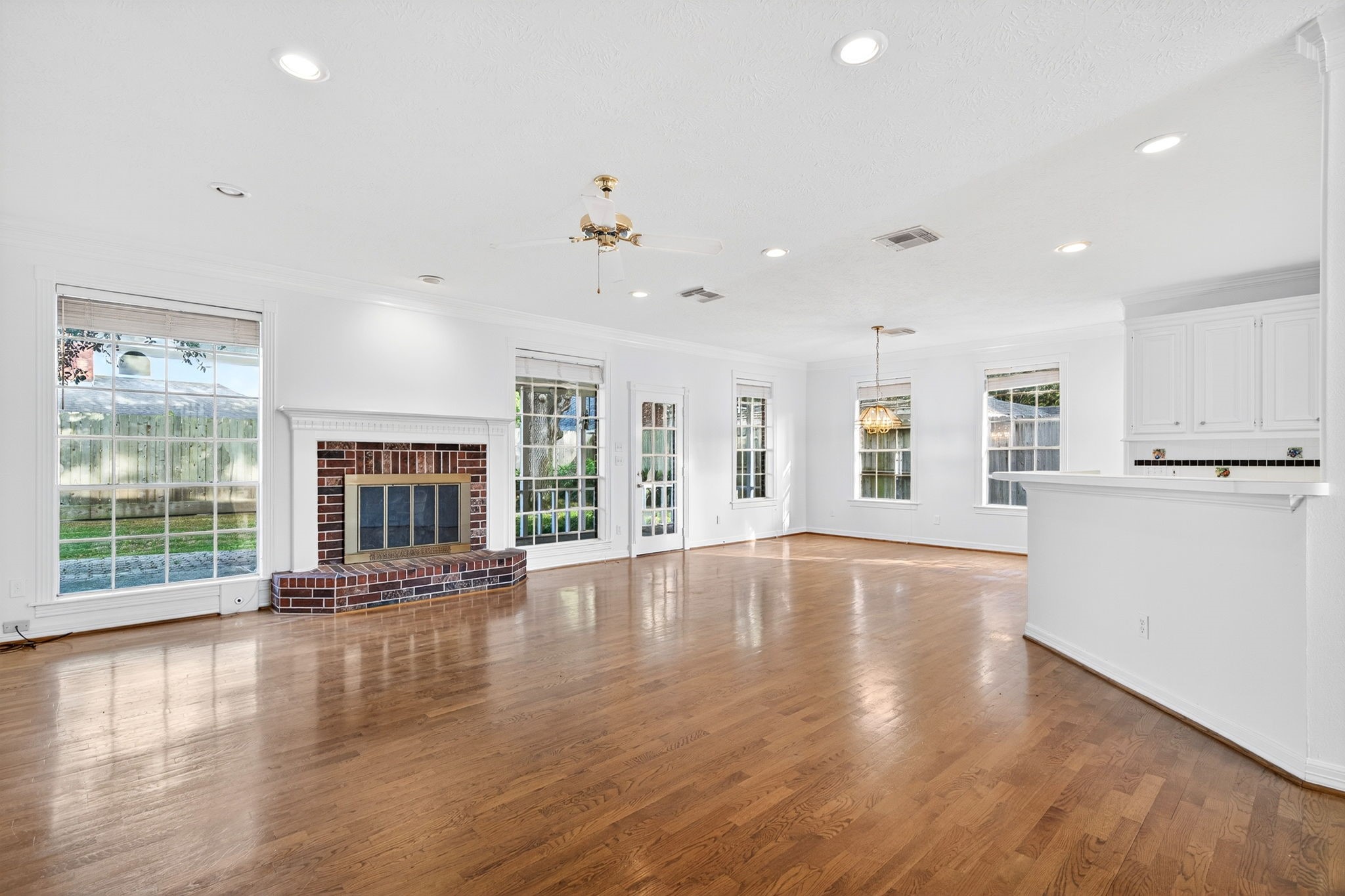 1022 Pinewood Lane Seabrook, TX 77586 - Photo 10 of 47 an empty room with wooden floor and windows