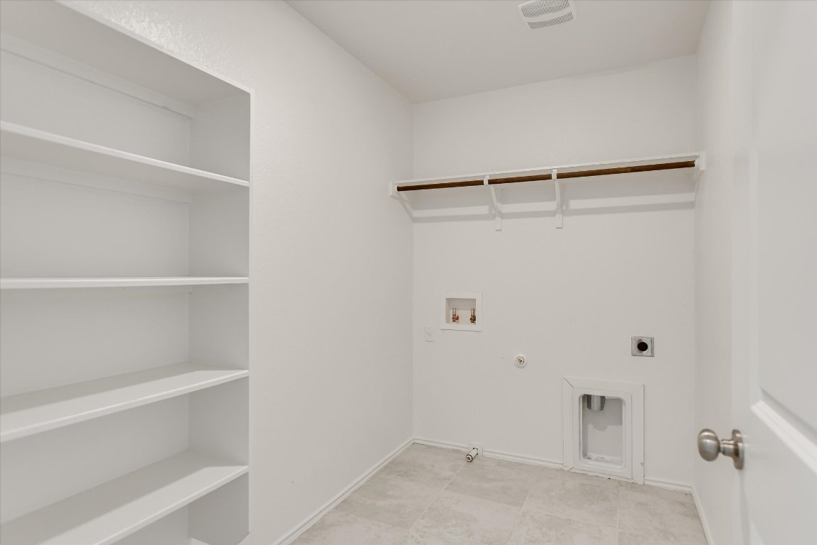 561 Greatest Gift Way Jarrell, TX 76537 - Photo 11 of 32 Busy families appreciate a large laundry room.