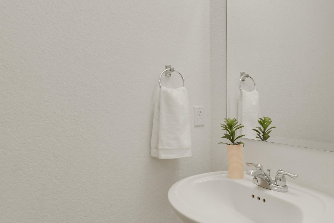 561 Greatest Gift Way Jarrell, TX 76537 - Photo 12 of 32 The powder room is located near the front door.