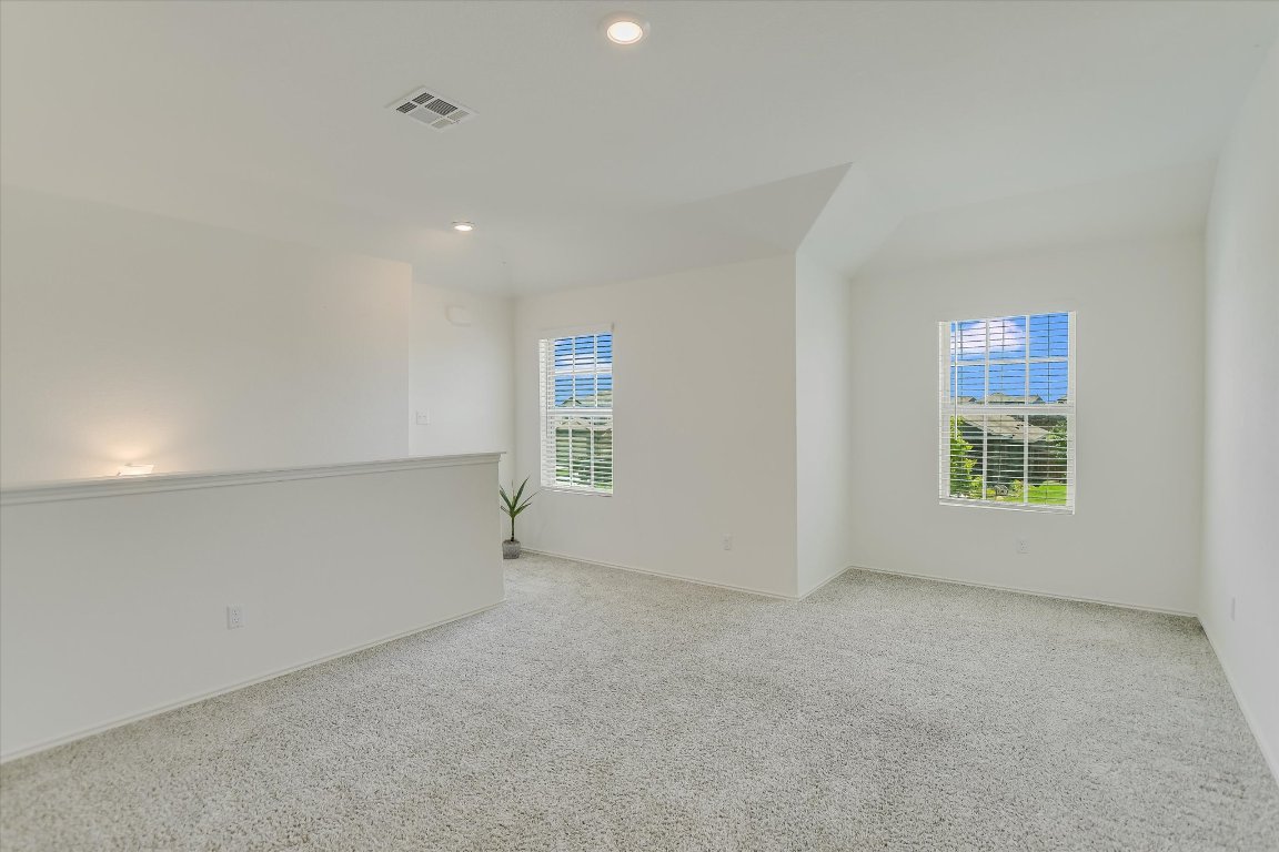 561 Greatest Gift Way Jarrell, TX 76537 - Photo 13 of 32 An upstairs living area provides a great spot for reading or gaming!