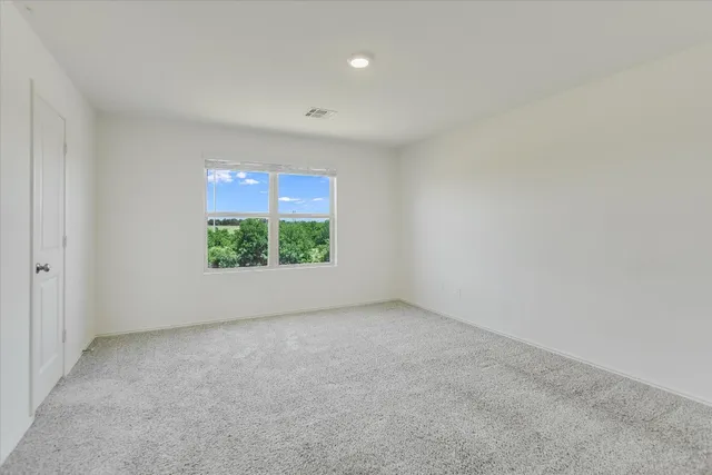 a view of a room with a large window