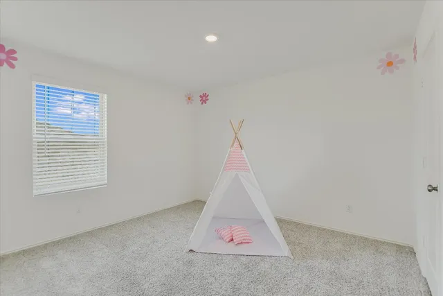 a room that has a rug and a window