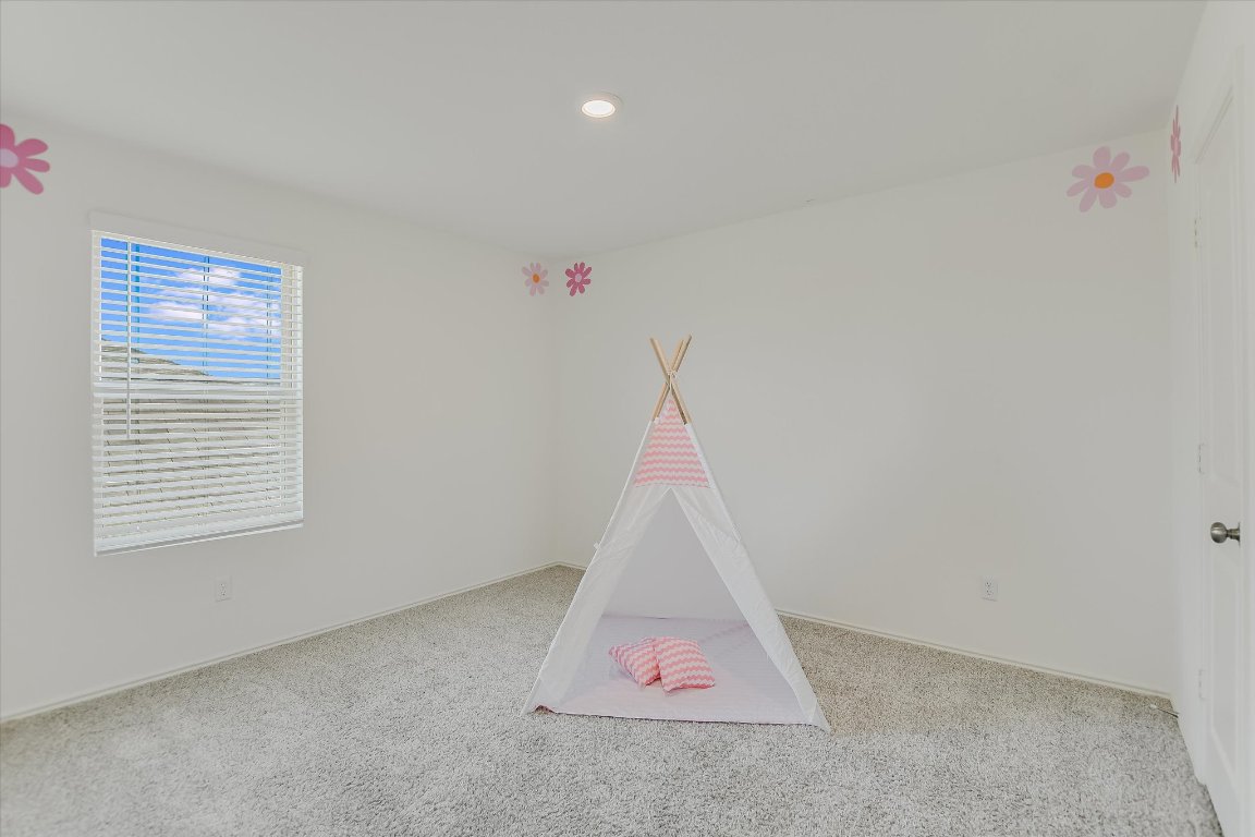 561 Greatest Gift Way Jarrell, TX 76537 - Photo 19 of 32 Game room featuring carpet, recessed lighting, and baseboards