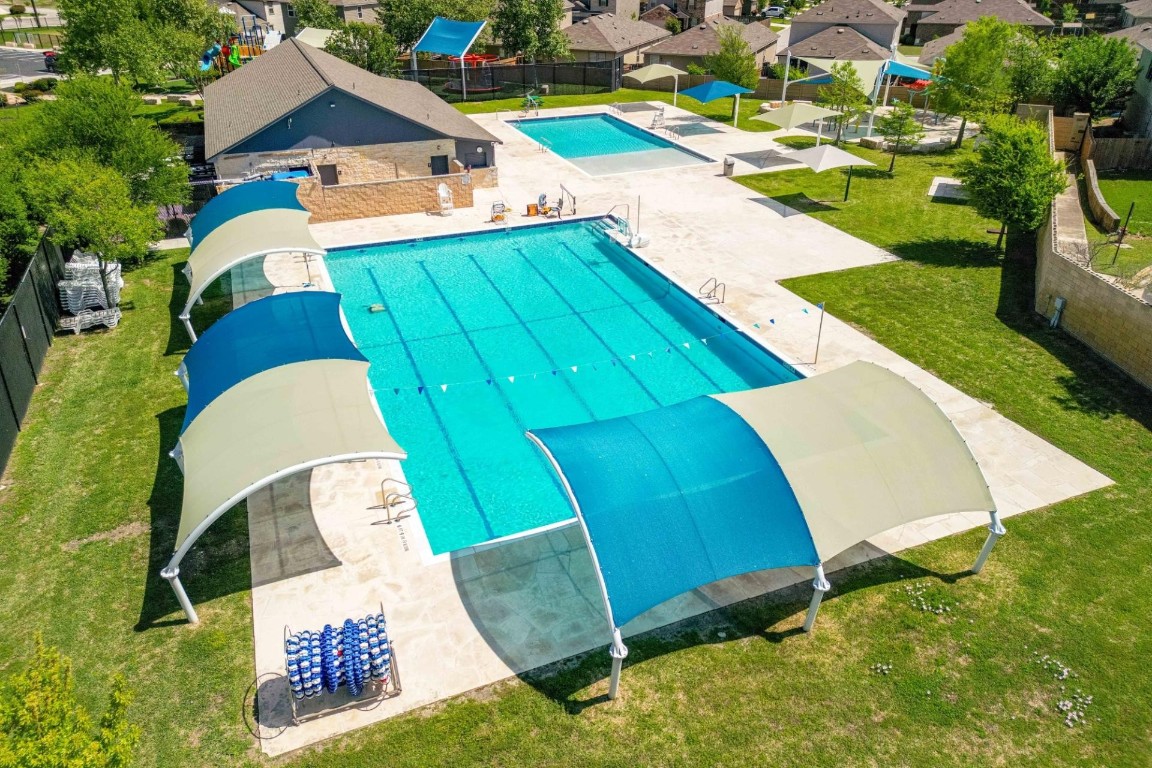 561 Greatest Gift Way Jarrell, TX 76537 - Photo 27 of 32 Sonterra community pool with a patio, the other amenity area for residents.