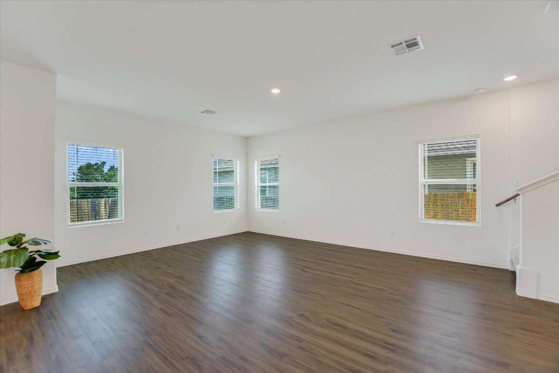 561 Greatest Gift Way Jarrell, TX 76537 - Photo 5 of 32 The large living room is open to the kitchen and eating area.