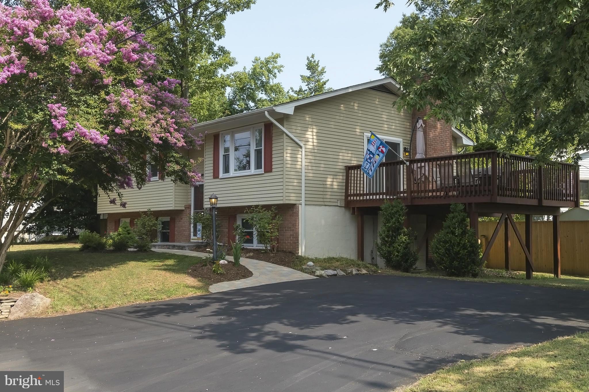 1747 Tacoma Road Edgewater, MD 21037 - Photo 1 of 19 a front view of a house with a yard