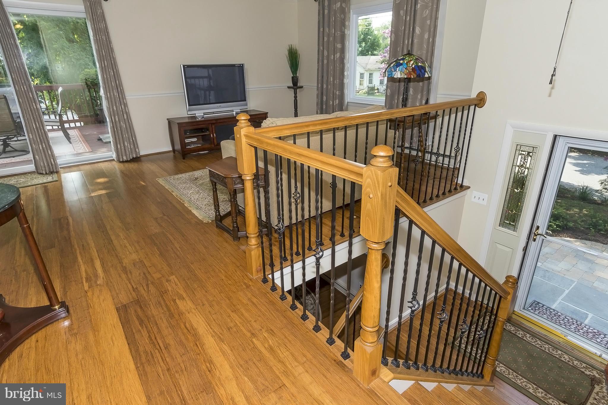 1747 Tacoma Road Edgewater, MD 21037 - Photo 2 of 19 a view of a hallway with wooden floor and stairs