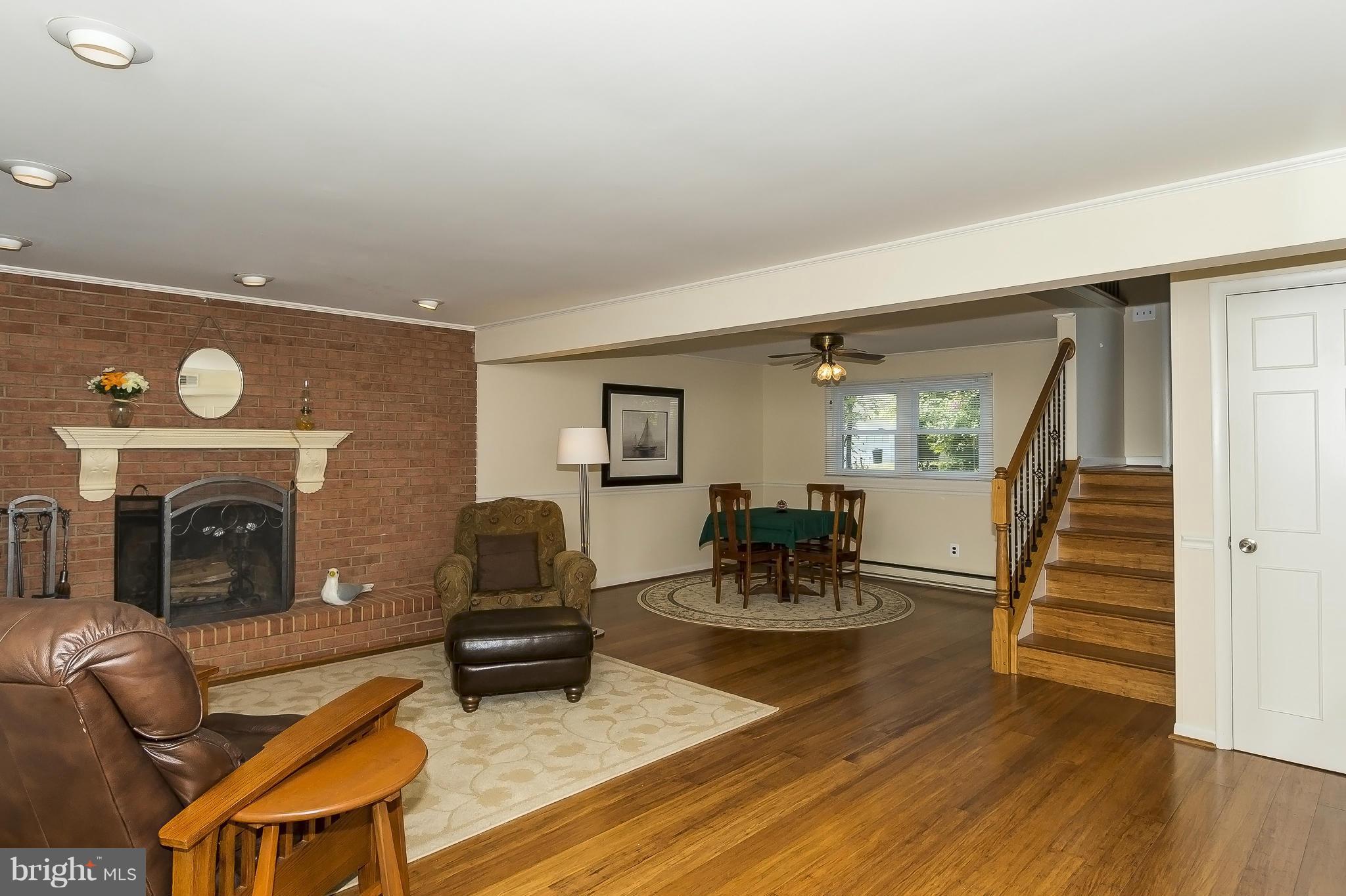 1747 Tacoma Road Edgewater, MD 21037 - Photo 15 of 19 a living room with furniture and a fireplace