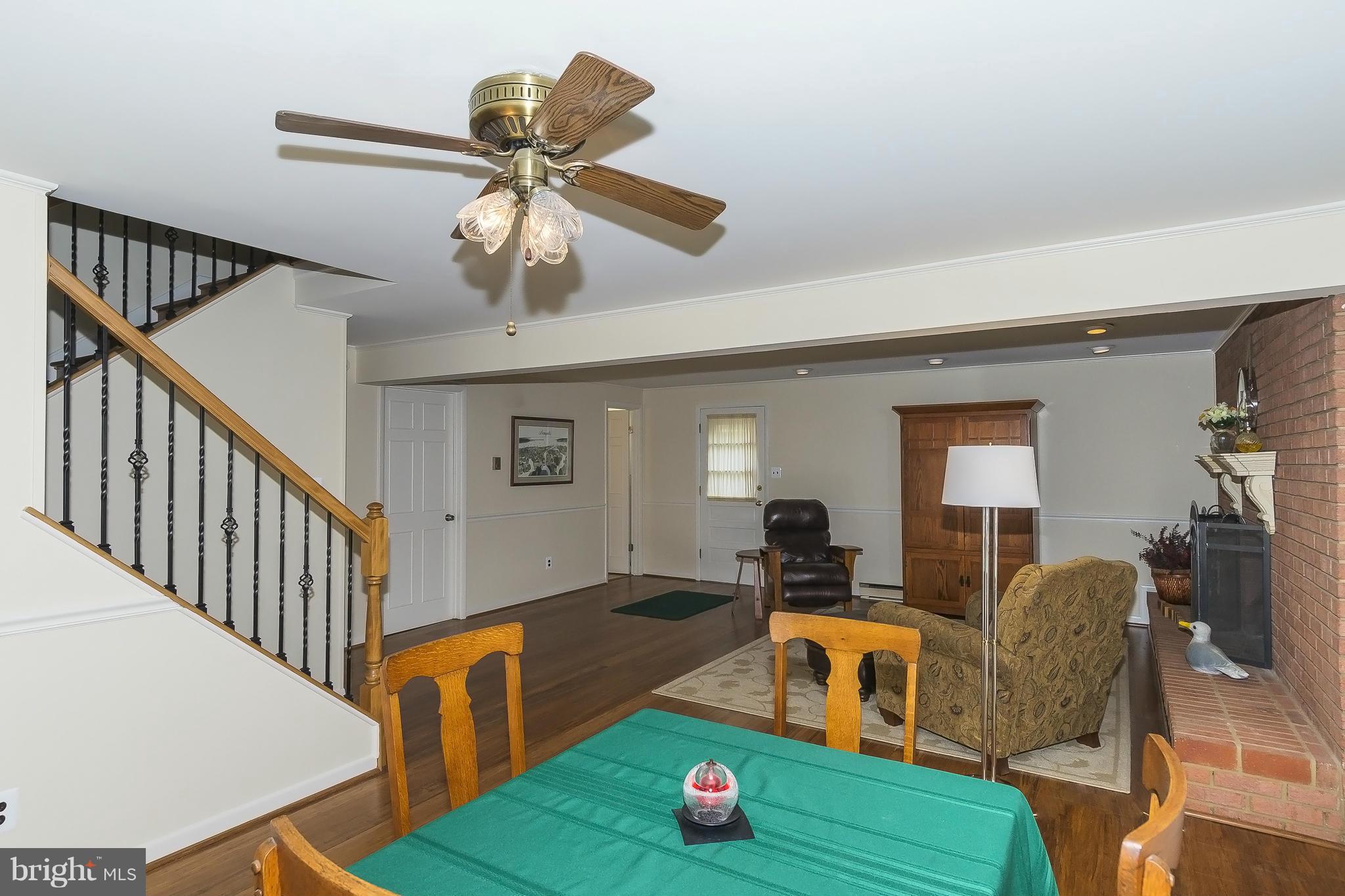 1747 Tacoma Road Edgewater, MD 21037 - Photo 16 of 19 a living room with furniture and a wooden floor