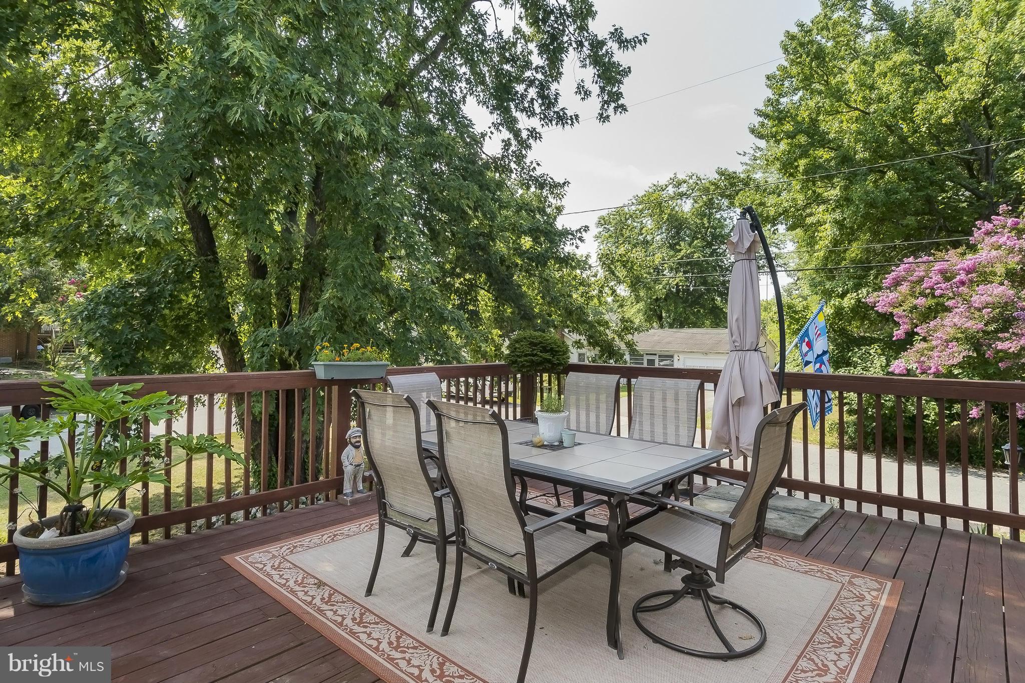 1747 Tacoma Road Edgewater, MD 21037 - Photo 18 of 19 a view of a chair and table on the deck