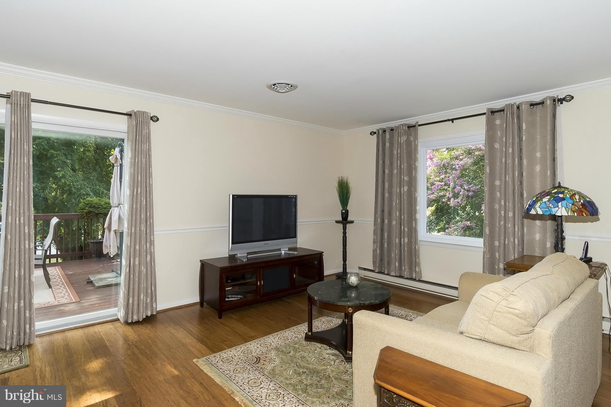 1747 Tacoma Road Edgewater, MD 21037 - Photo 3 of 19 a living room with furniture and a flat screen tv