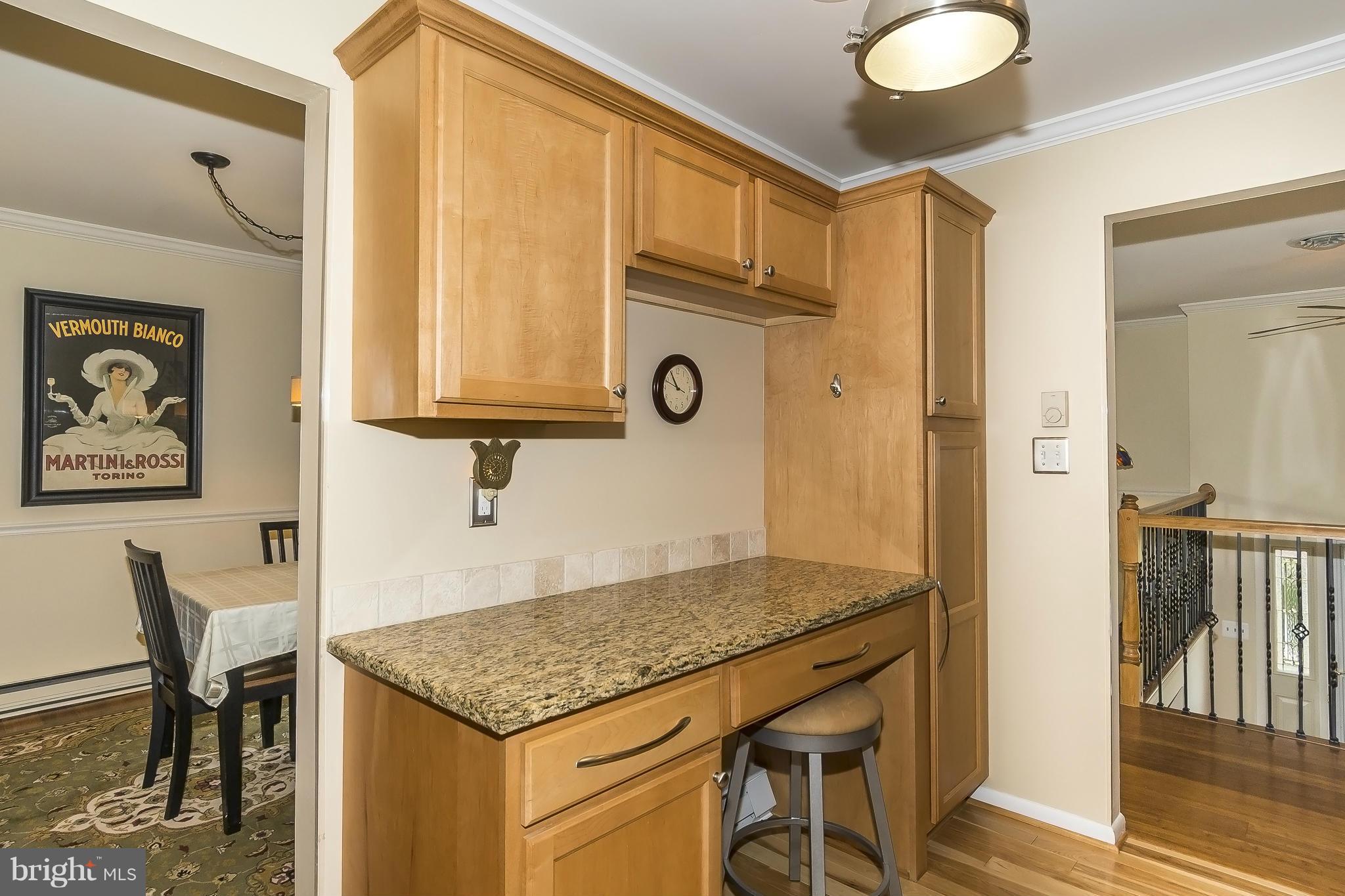 1747 Tacoma Road Edgewater, MD 21037 - Photo 8 of 19 a view of kitchen island dining room cabinets and wooden floor